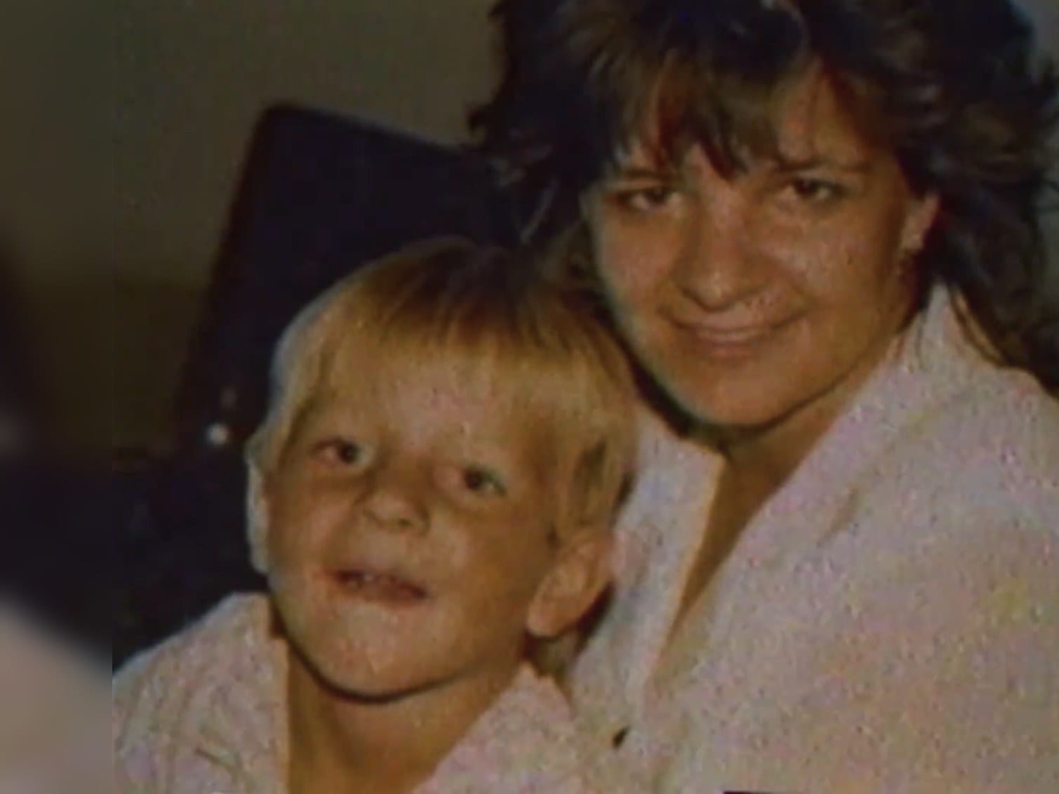 Delano as a small boy with his mother, a home-video still